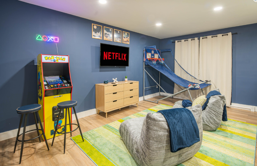 Colorful bunk room with arcade games, Netflix, and kid-friendly entertainment in a Scottsdale short-term rental managed by Arizona STR Management