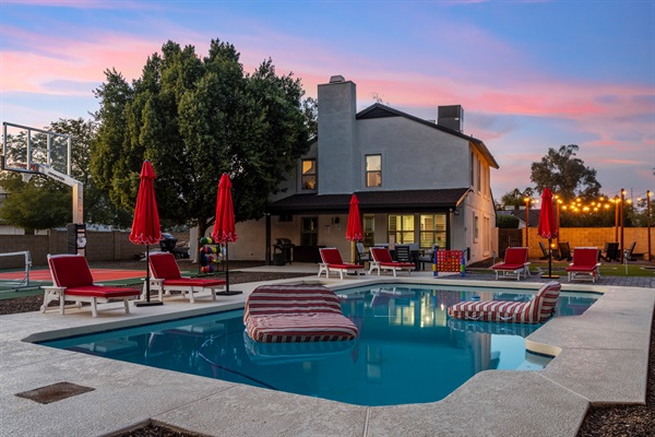 Scottsdale short-term rental home with private pool, lounge chairs, and sunset views — managed by Arizona STR Management